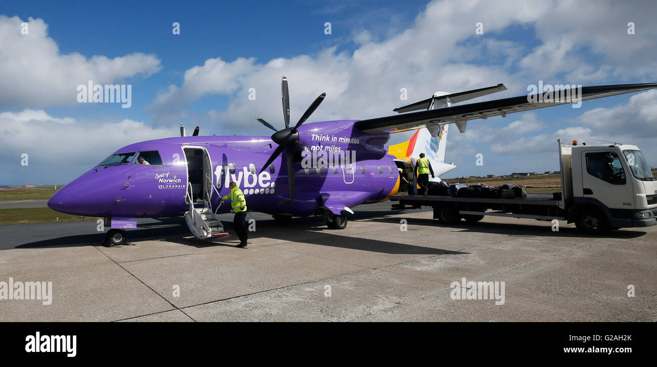 A Dornier 328 painted in the purple colours of Loganair, a Flybe franchise partner at Kirkwall airport. Stock Photo