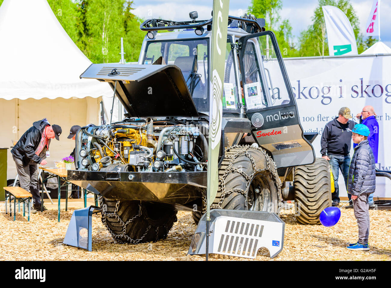 Emmaboda, Sweden - May 14, 2016: Forest and tractor (Skog och traktor) fair. Malwa forwarder with open hood and visible motor. Stock Photo