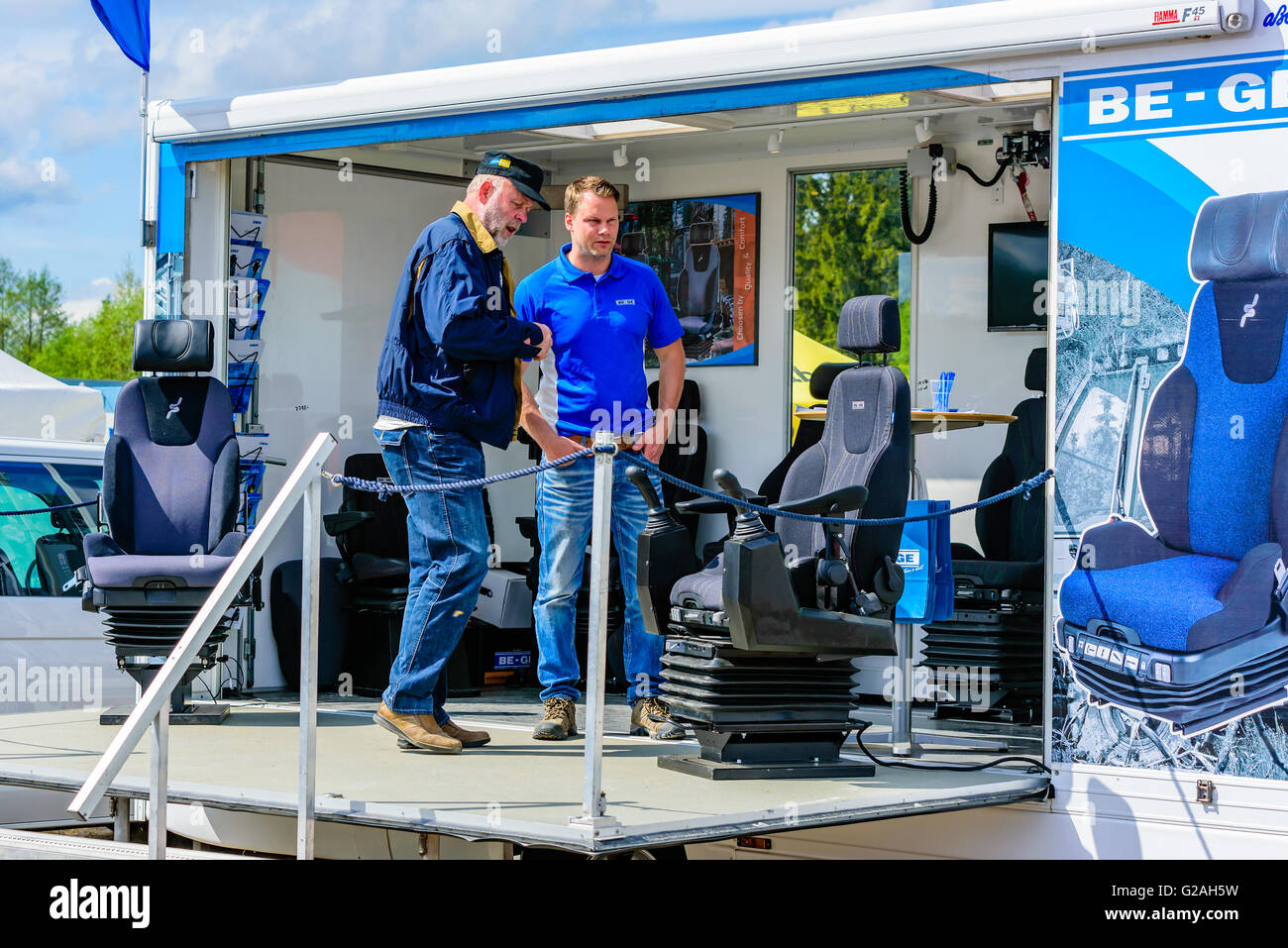 Emmaboda, Sweden - May 14, 2016: Forest and tractor (Skog och traktor) fair. Salesperson and visitor looking at Be-Ge drivers se Stock Photo