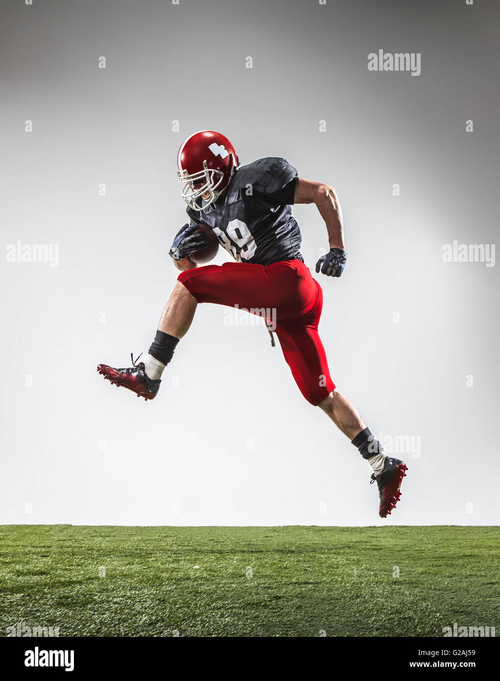 The american football player in action Stock Photo - Alamy