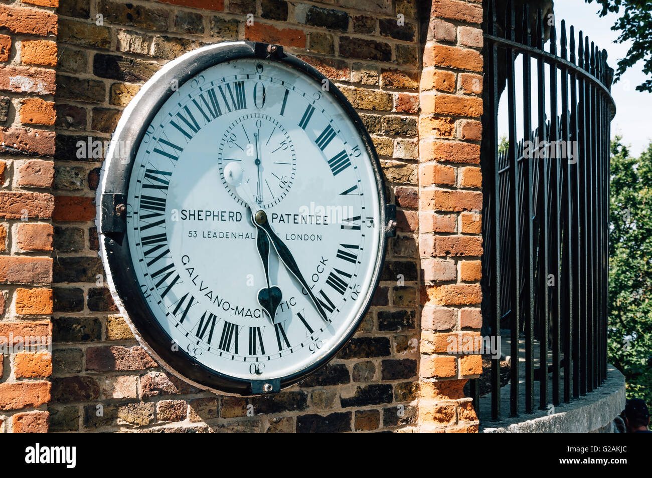 LONDON, UK - AUGUST 22, 2015:  The Shepherd gate 24-hour clock, outside the Royal Greenwich Observatory. Galvano magnetic clock. Stock Photo