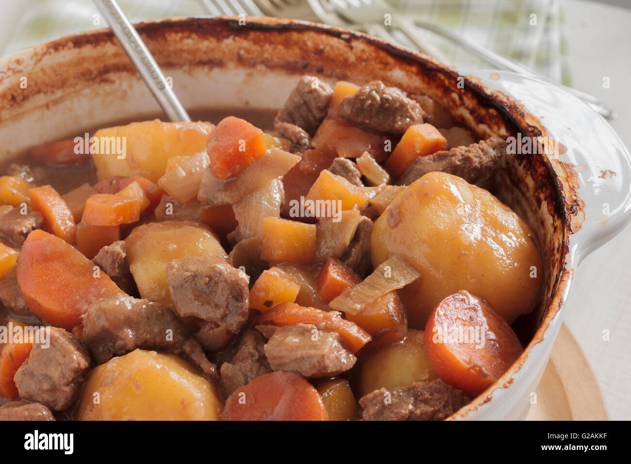 Hearty meat and vegetable stew a traditional dish containing meat gravy potatoes turnips onions and carrots Stock Photo