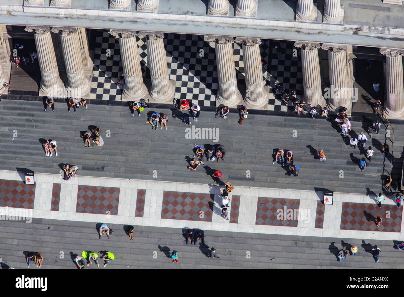 A close up aerial view of people sitting on the steps of St Pauls Cathedral Stock Photo