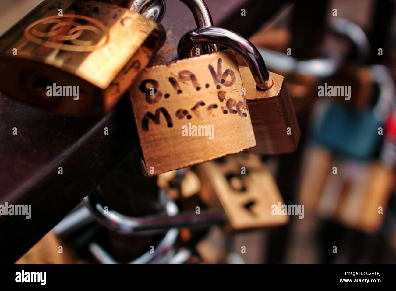 Love locks attached to a railing Stock Photo - Alamy