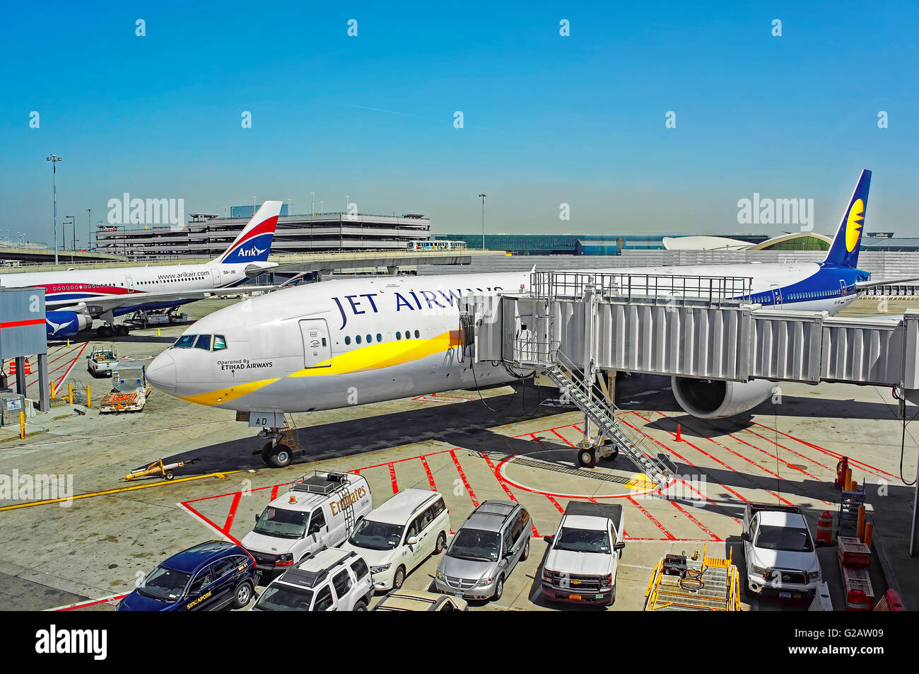 New York, USA - May 7, 2015: Airplane and jet bridge at JFK international airport Stock Photo