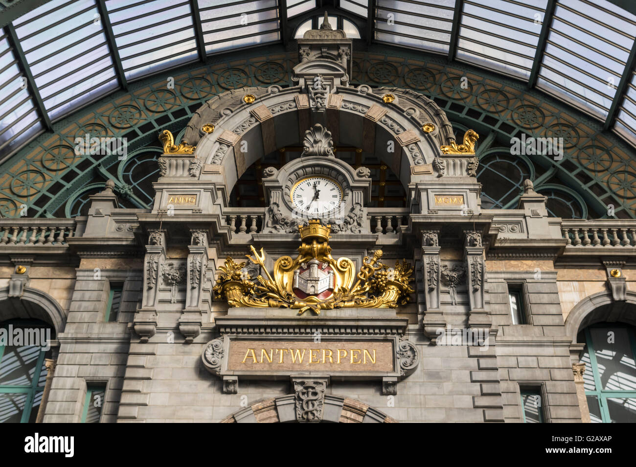 Ornaments and clock of Antwerpen Centraal train station, inaugurated 1905. Antwerp, Belgium. Stock Photo