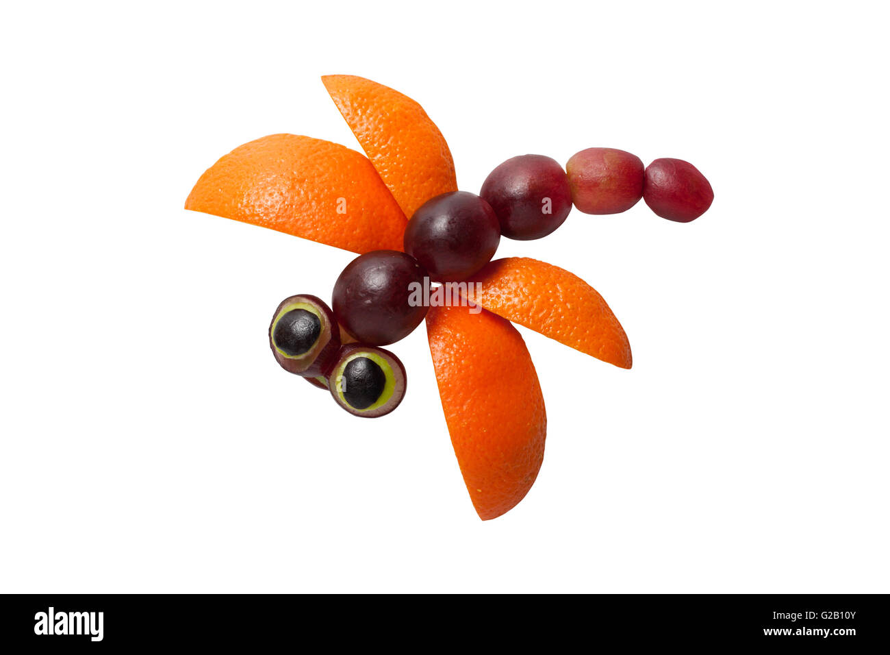 Beautiful dragonfly made of grape and orange Stock Photo