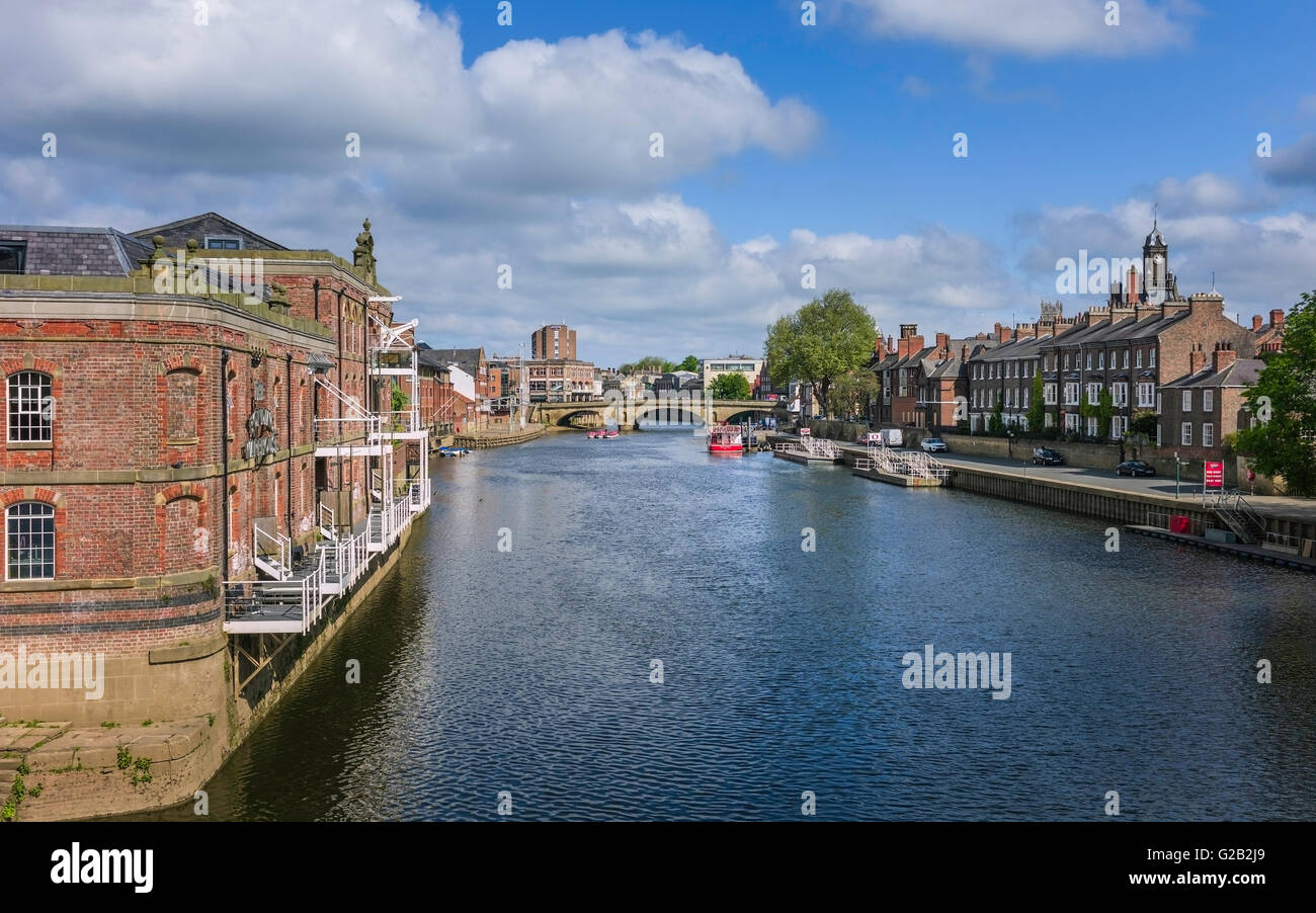 River Ouse with old buildings along the river bank and in the background Lendal Bridge on a bright spring day. Stock Photo