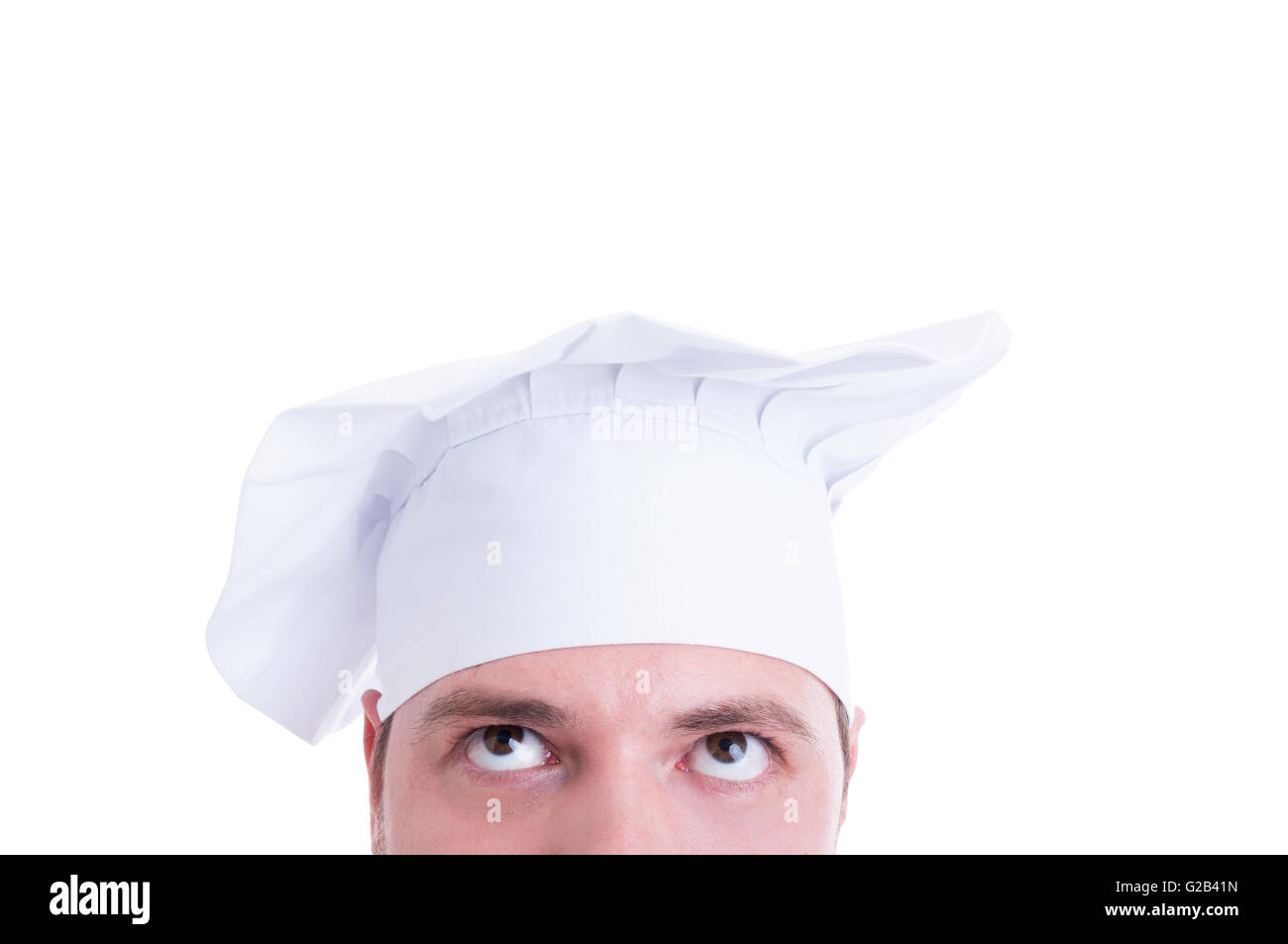 Closeup of cook or chef forehead, hat and eyes looking up isolated on ...