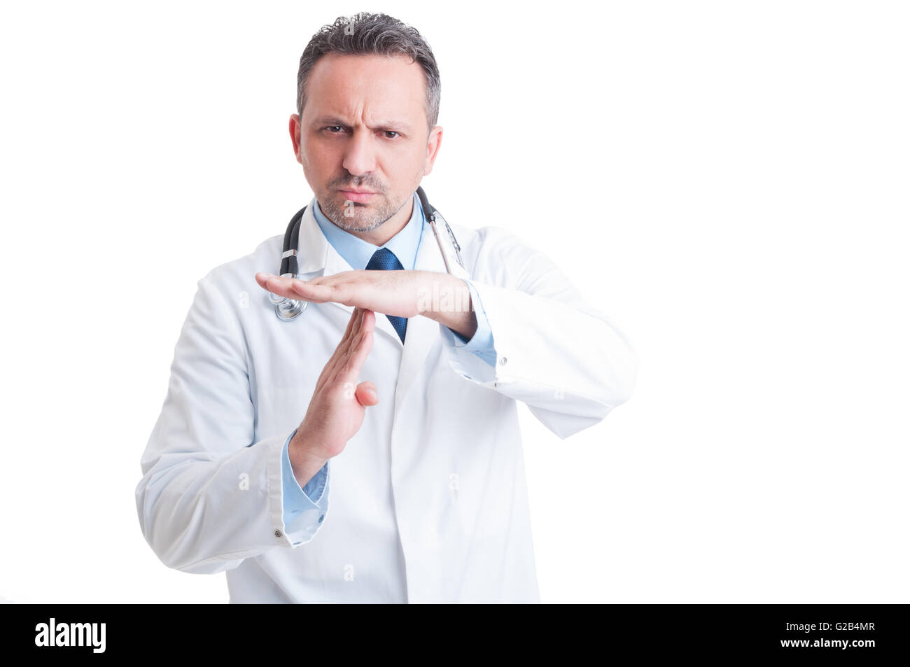Serios doctor or medic requesting break and time out by making the gesture isolated on white background Stock Photo