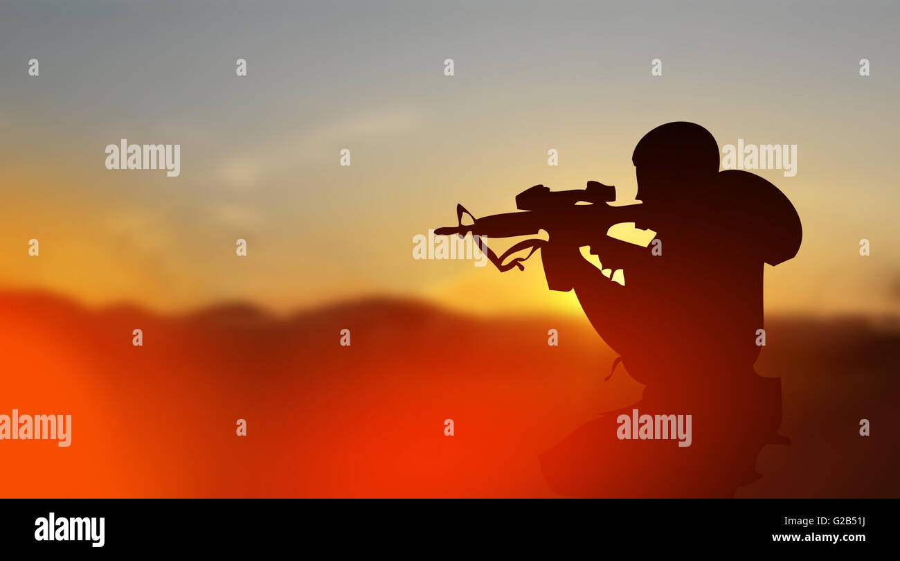 Army soldier silhouette in conflict zone concept at sunset Stock Photo