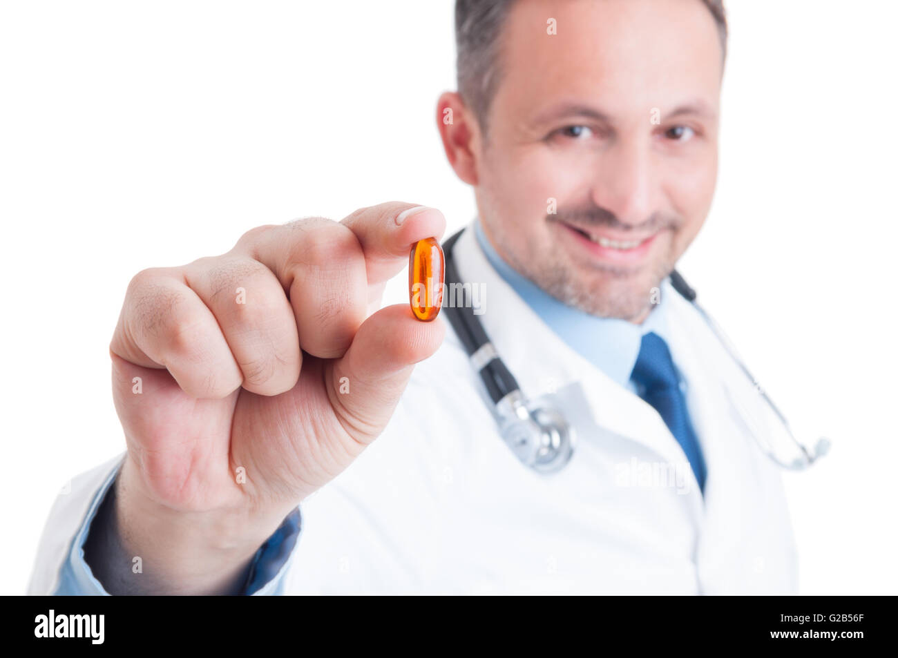 Doctor holding and showing one transparent pill of fish oil as lecithin