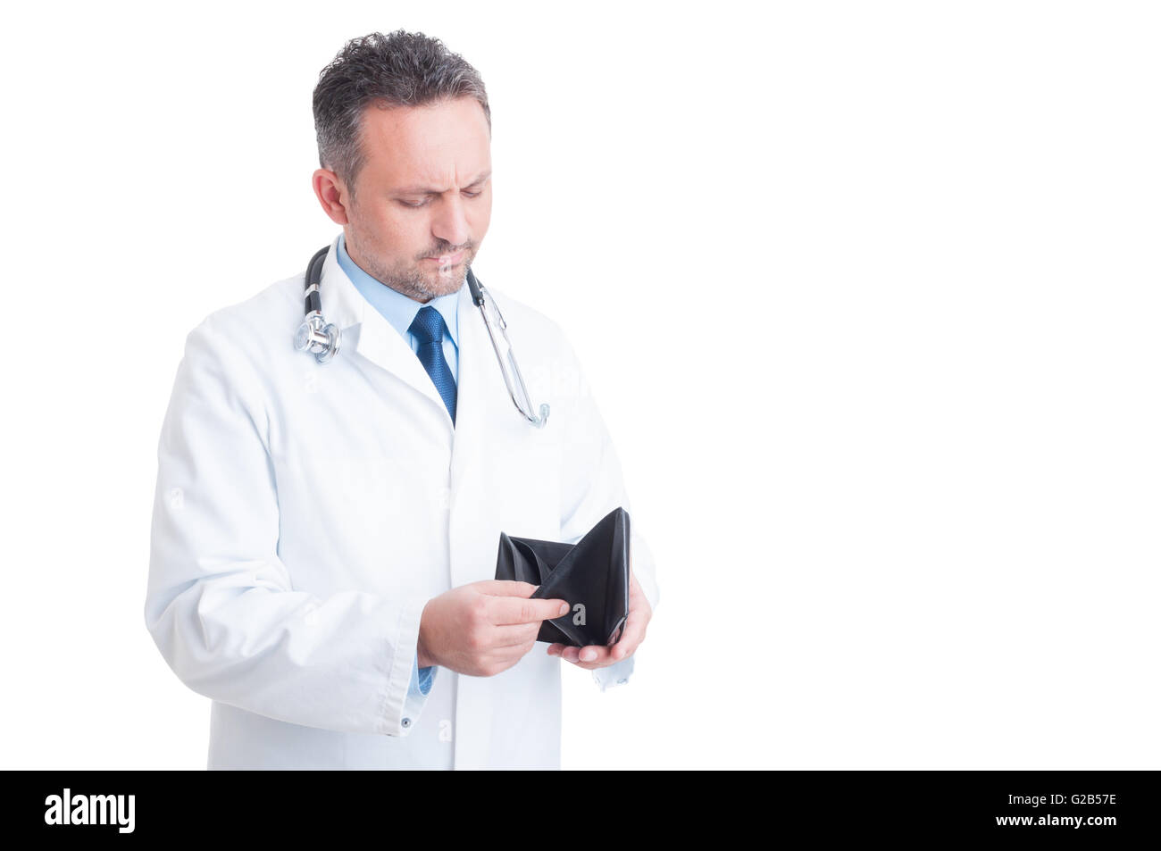 Bankrupt male doctor or medic checking empty wallet isolated on white background Stock Photo