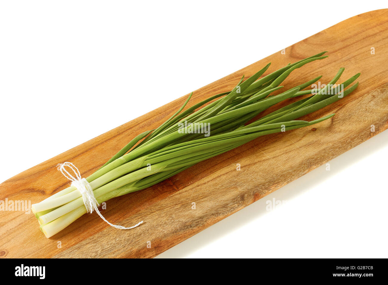 Fresh green onion on wooden board Stock Photo - Alamy