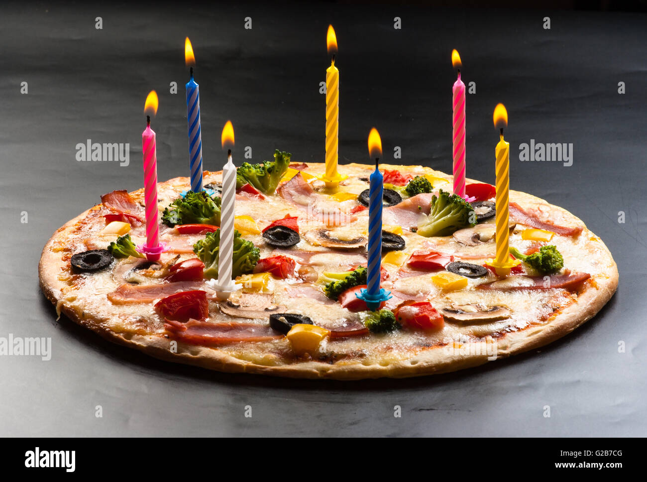 Festive candles pizza with mushrooms, cauliflower, olives, cheese and sweet pepper Stock Photo