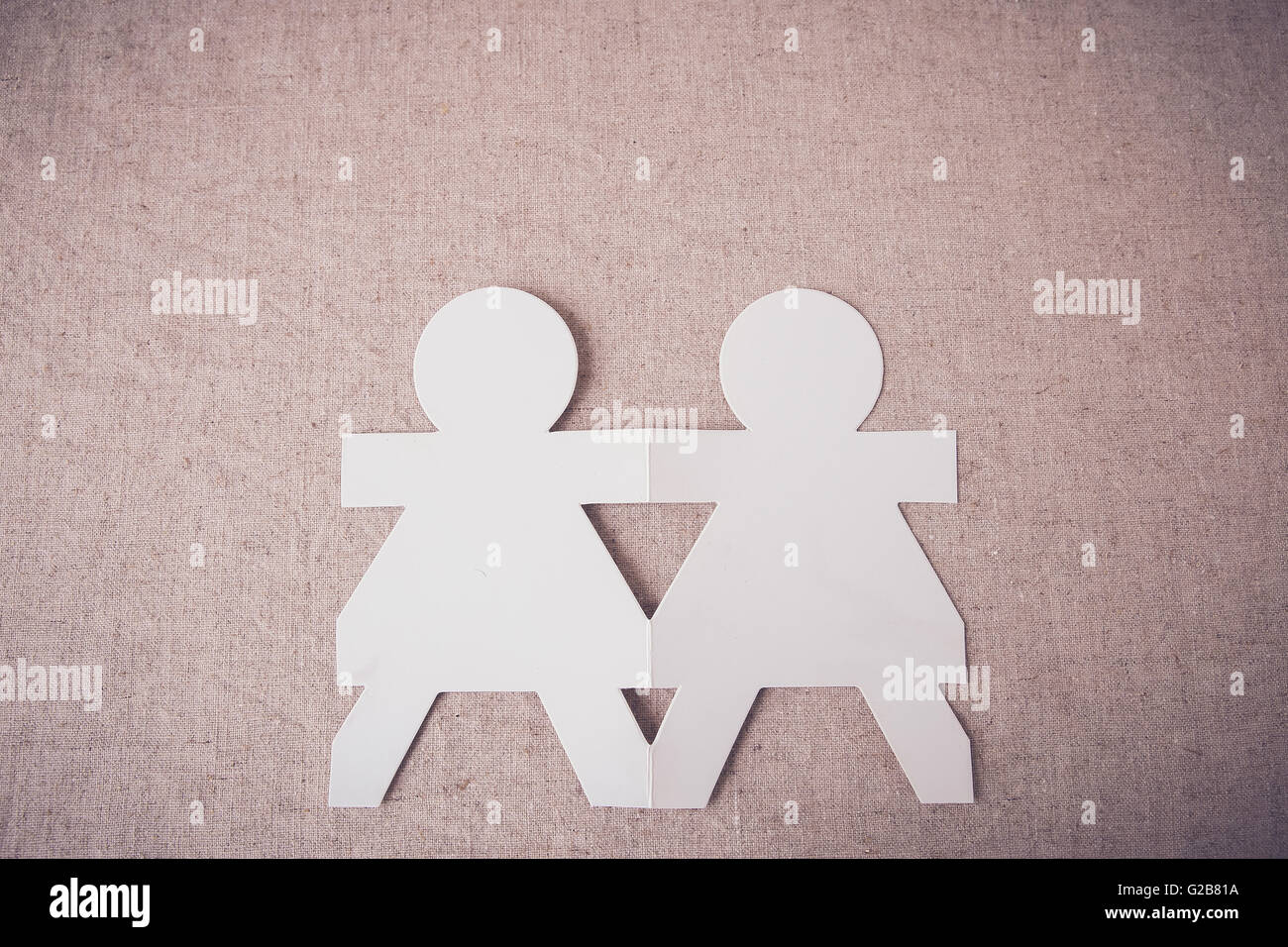 Paper dolls holding hands hires stock photography and images Alamy