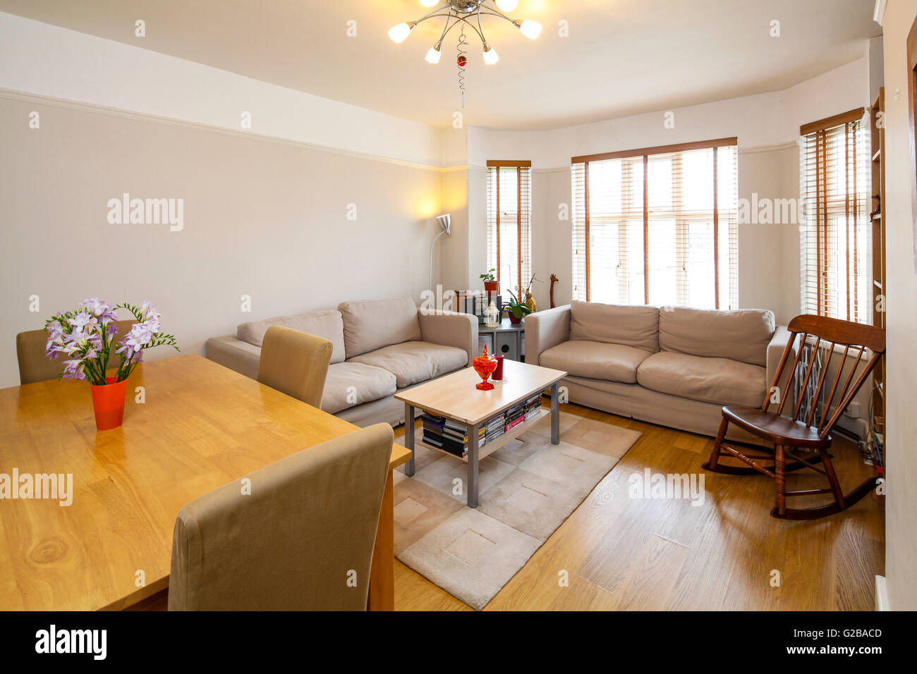 Creighton House, North London. Living room with traditional furniture and dining table. Stock Photo