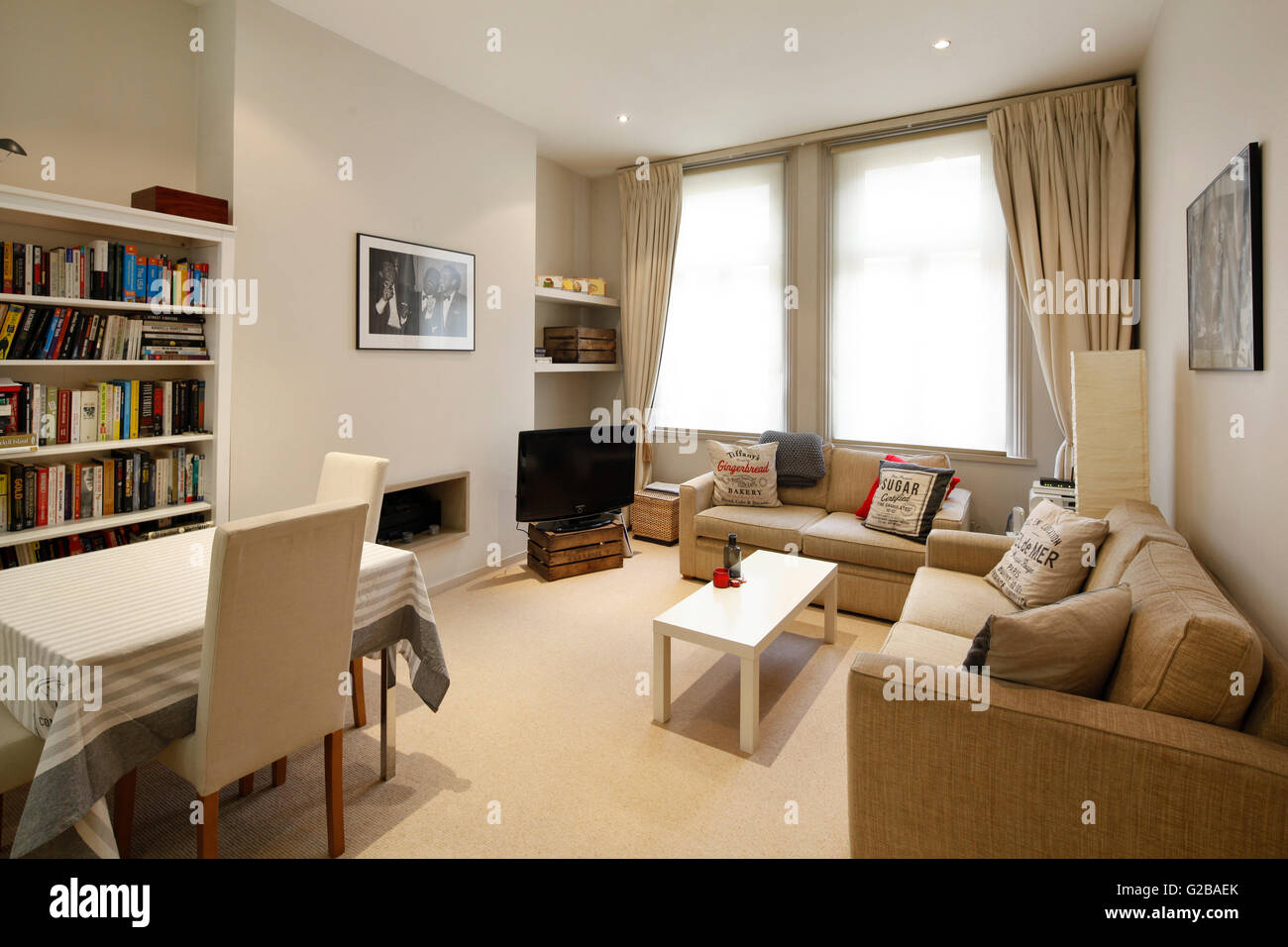Foley House, Maddox Street. Open plan living room and dining area with large windows and neutral tones. Stock Photo