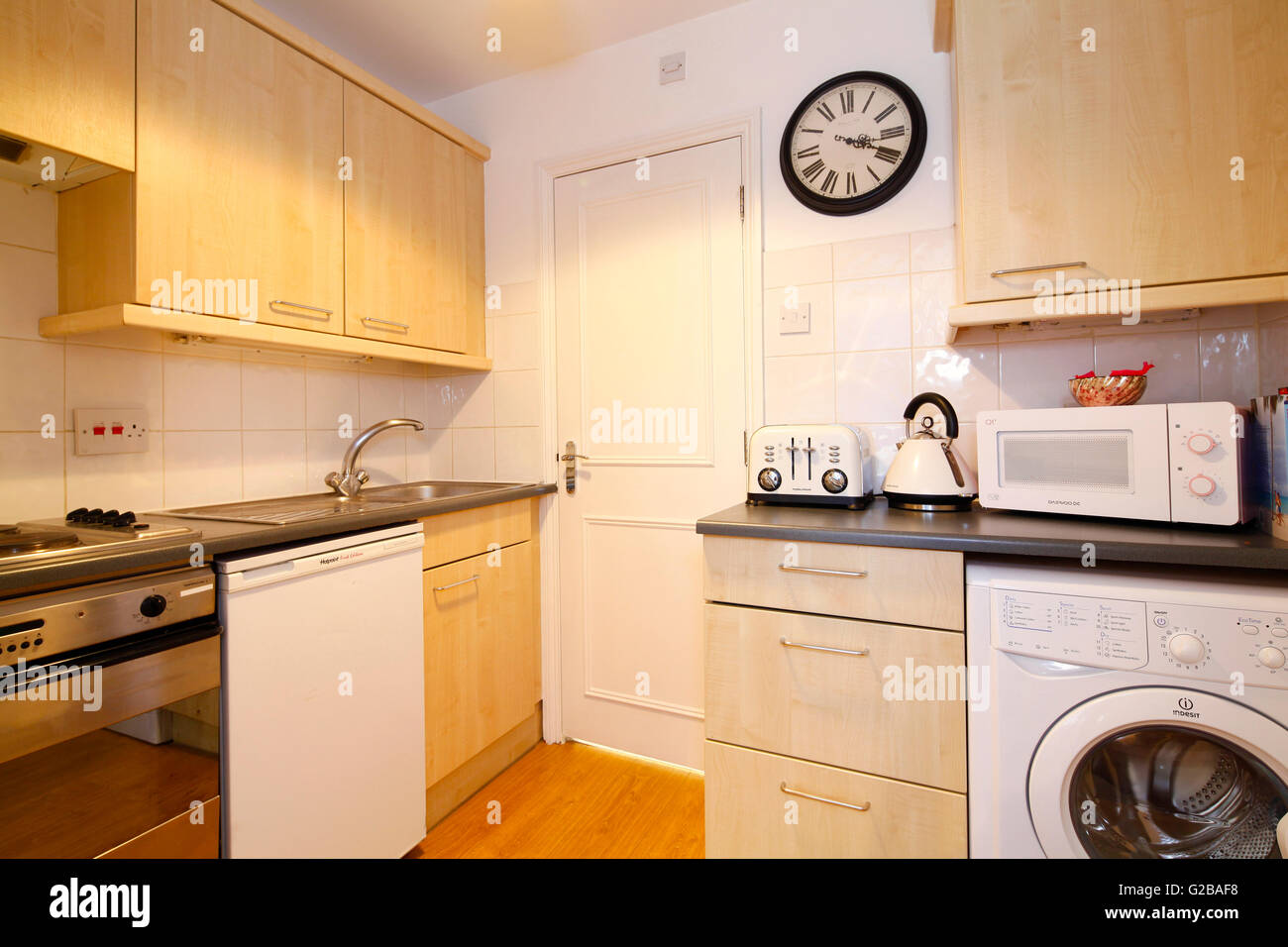 Harrington Gardens. Small kitchen with traditional features. Stock Photo