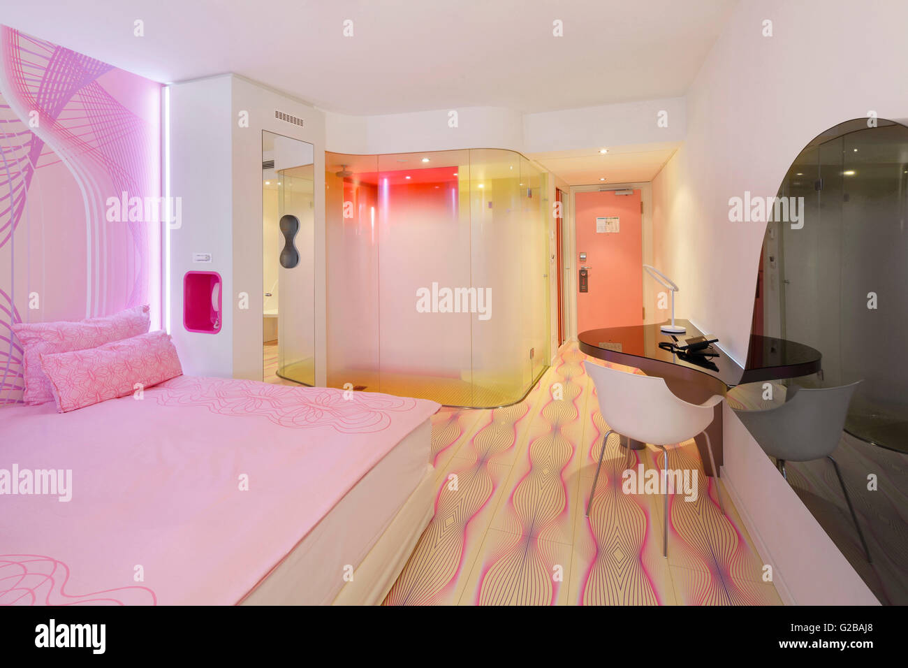 nhow Hotel opened in 2010 as a music and lifestyle hotel along the Spree  river in Berlin. Partial view of a modern colourful bedroom. Pink bedding  and pink wall Stock Photo - Alamy