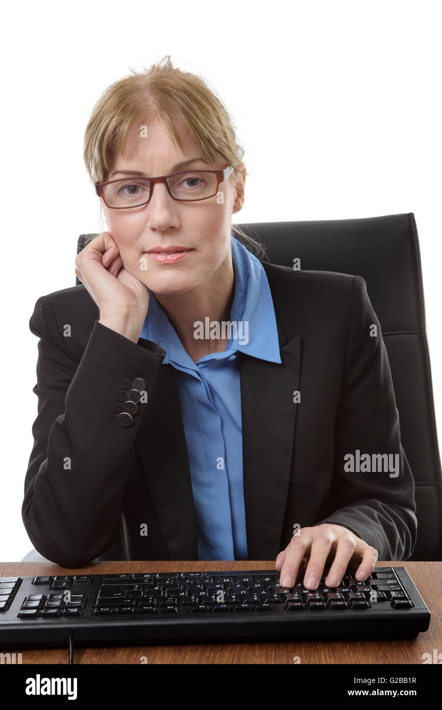Office worker sits at her desk, ready to type on a keyboard, isoalted ...