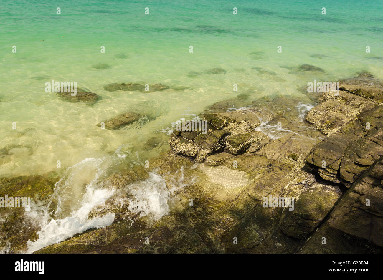 Clear Sea Rocks Rocks and sand the clear sea water Stock Photo - Alamy