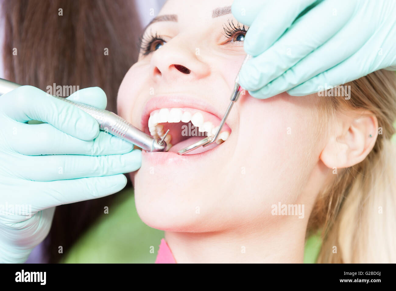Dental drilling procedure at dentist as orthodontic concept Stock Photo