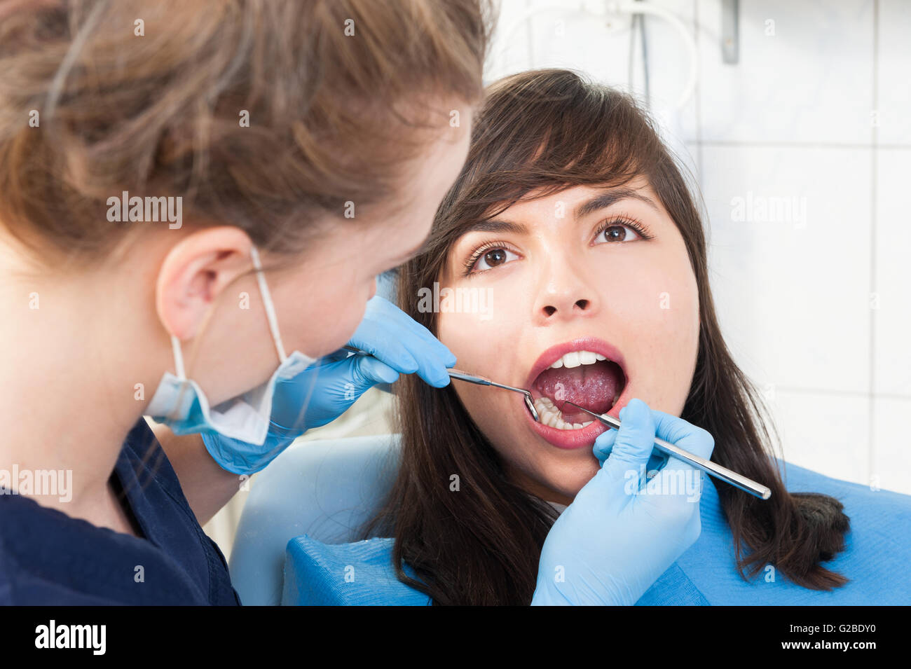 Patient with healthy teeth at dentist office getting an oral