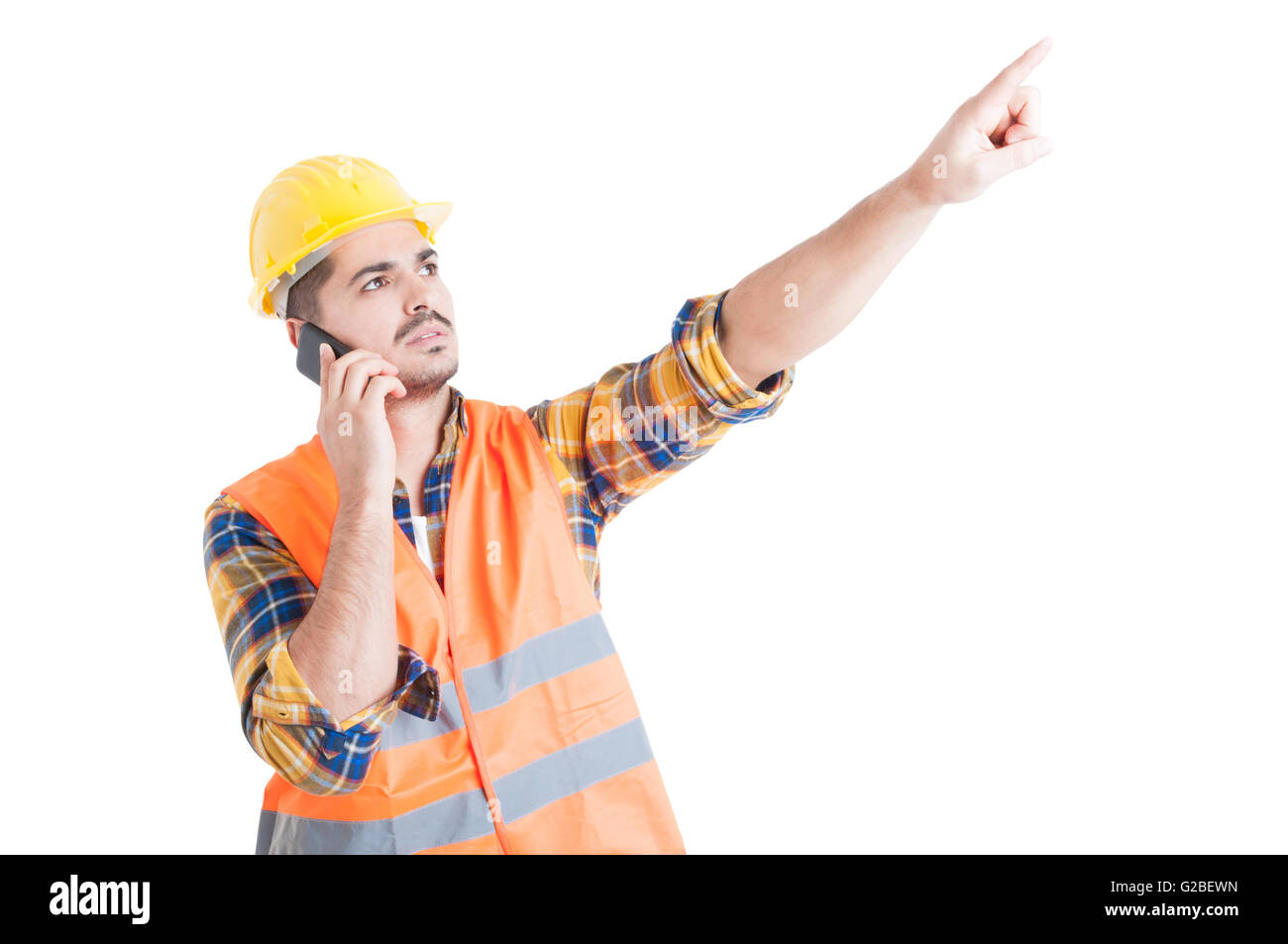 Attractive engineer pointing finger upwards or showing something while ...