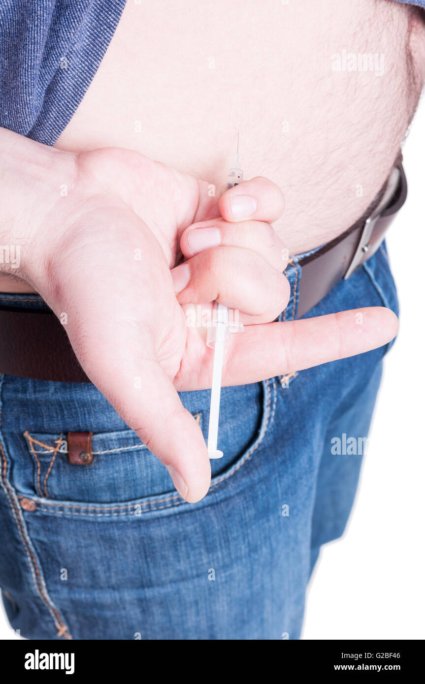 Patient with first type diabetes making an injection in his abdomen as insulin injection concept isolated on white background Stock Photo