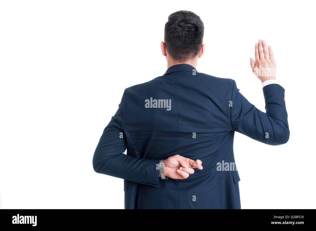 Dishonest lawyer making fake oath or pledge with fingers crossed behind back Stock Photo