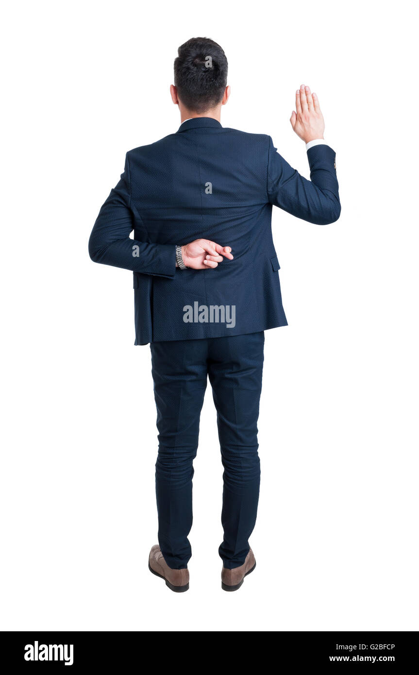 Back view of lawyer making fake oath with fingers crossed standing isolated on white background Stock Photo