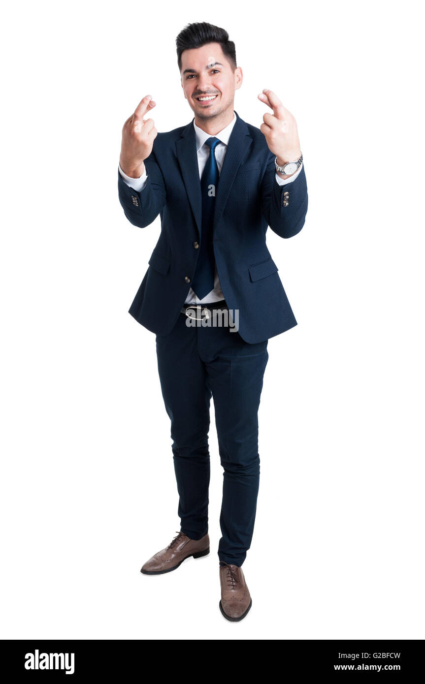 Salesman or businessman feeling lucky and making double good luck gesture smiling confident Stock Photo