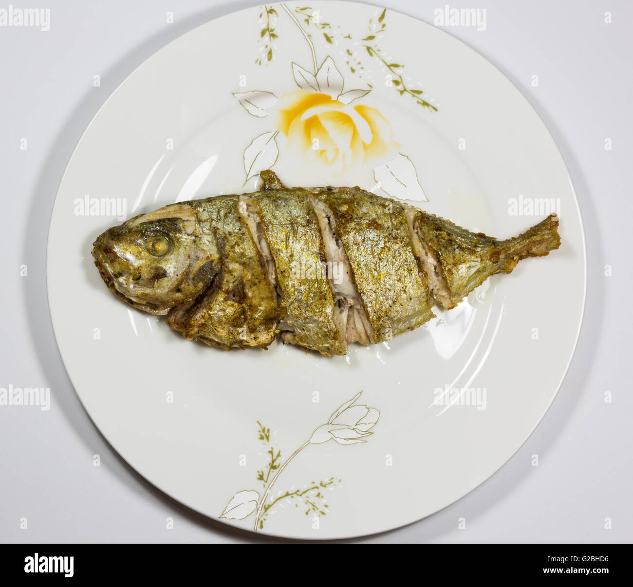 Fried fish on the plate Stock Photo