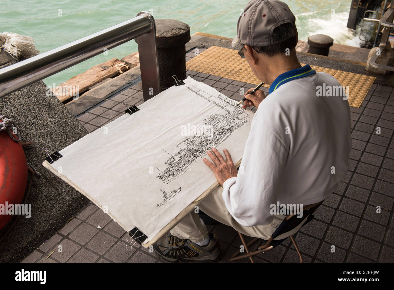 Artist drawing cityscape of Hong Kong Stock Photo