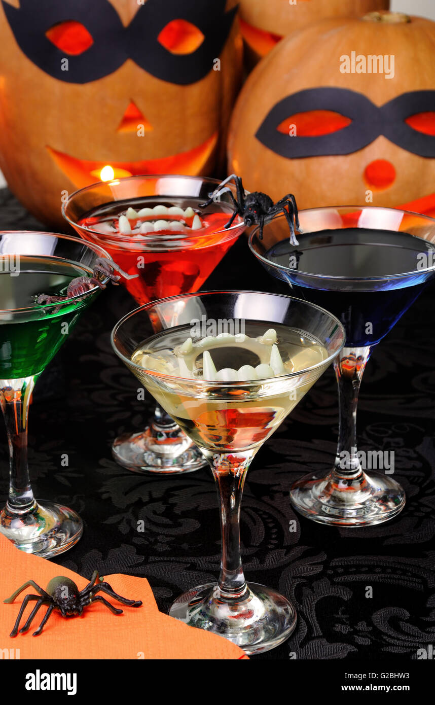 Glasses with different drinks on the table in honor of Halloween Stock Photo