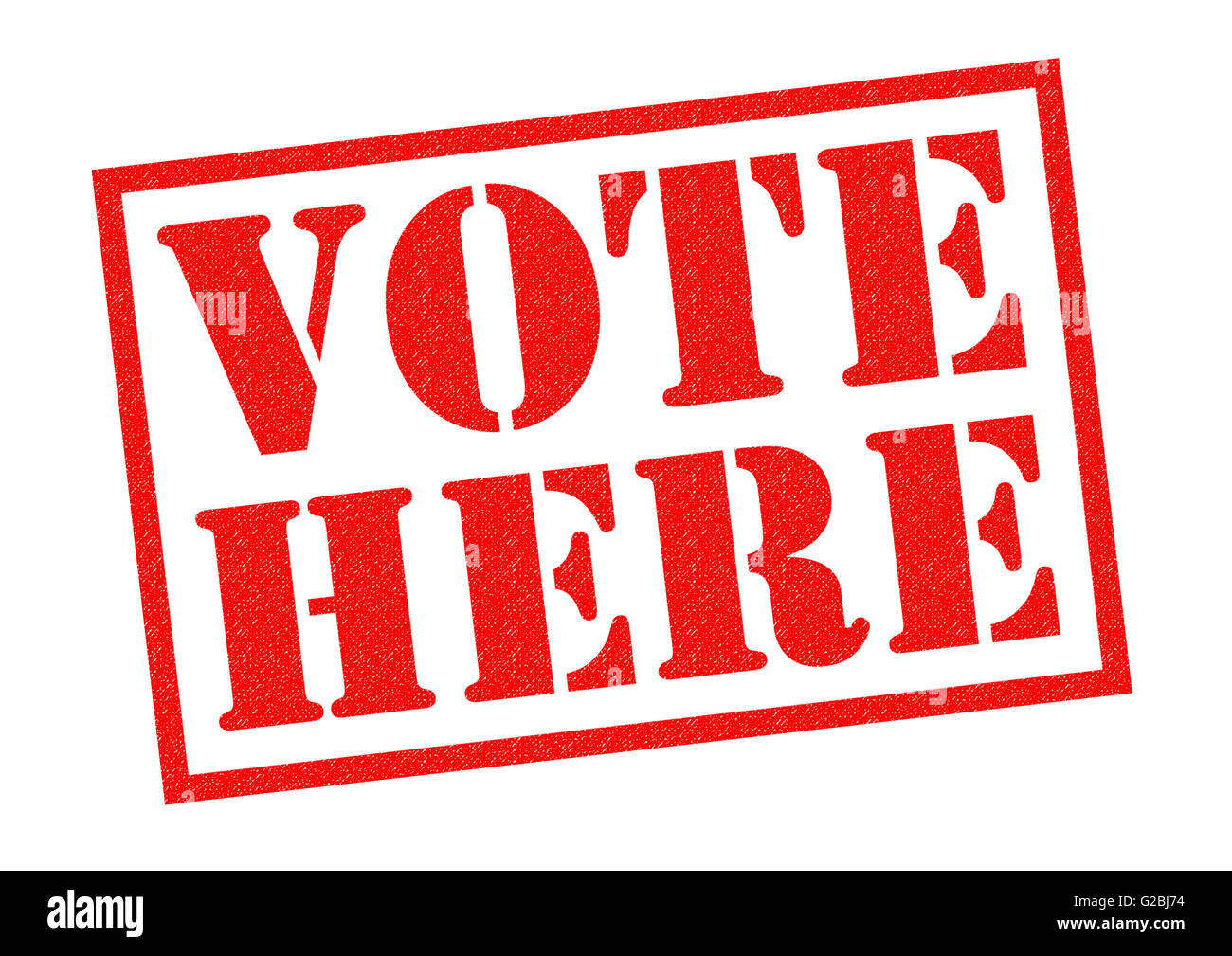 VOTE HERE red Rubber Stamp over a white background. Stock Photo