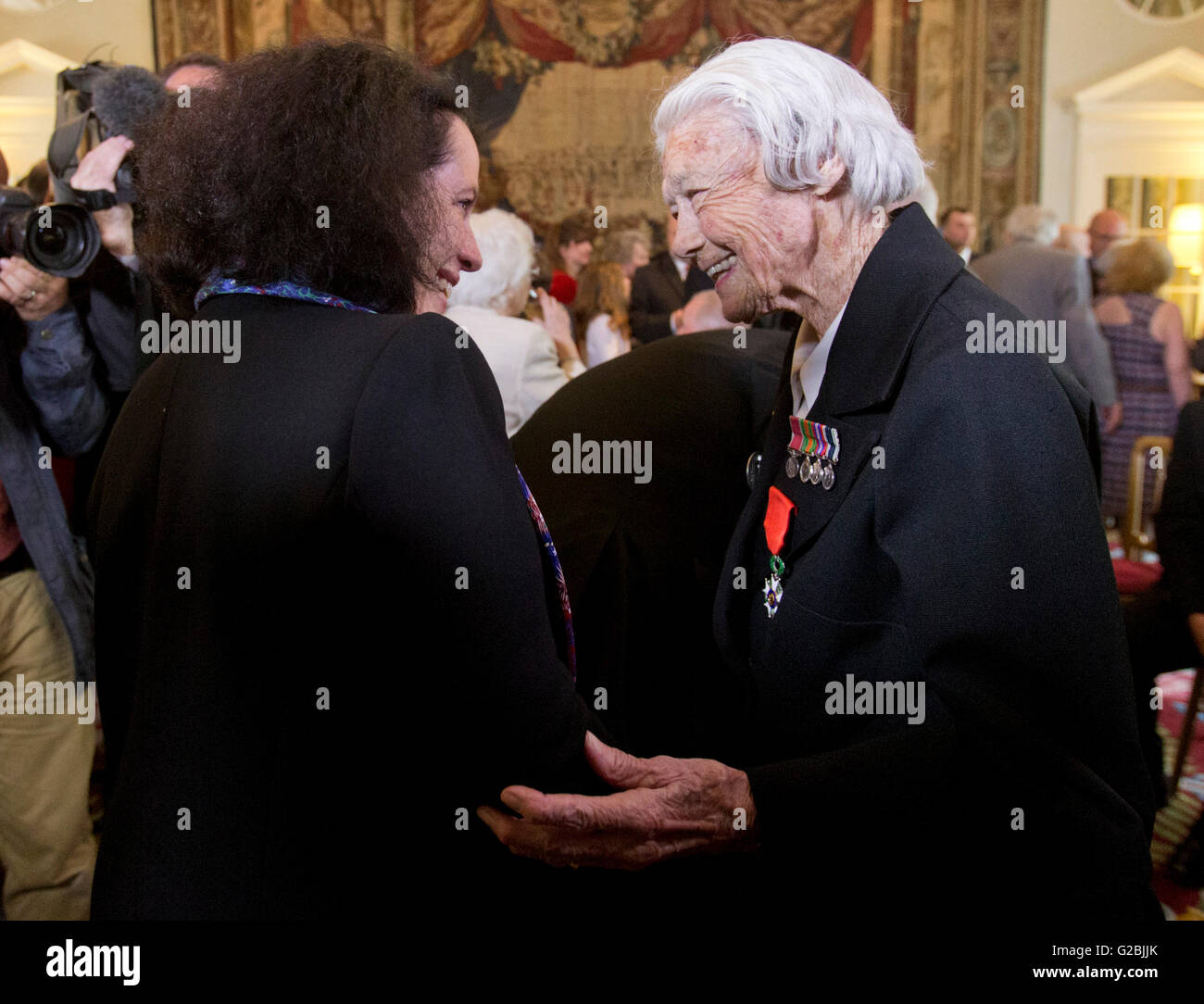 Veteran Marsie Taylor (right), 96, the first woman to be awarded the Legion d'honneur, is presented with her medal by French Ambassador Sylvie Bermann for her role in the liberation of France, a few days ahead of the 72nd anniversary of D-Day during a ceremony at the French residence in Kensington, London. Stock Photo