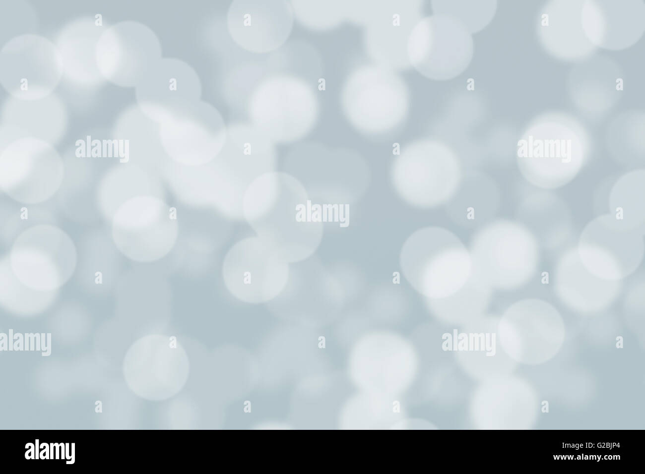 Abstract circular grey and white light bokeh background Stock Photo