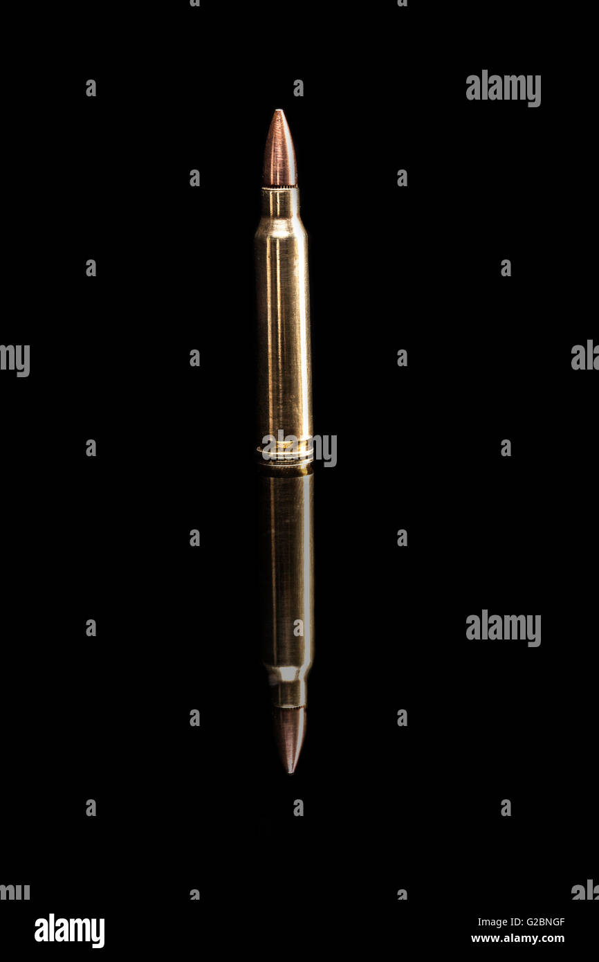 Bullet isolated on black background with reflexion Stock Photo