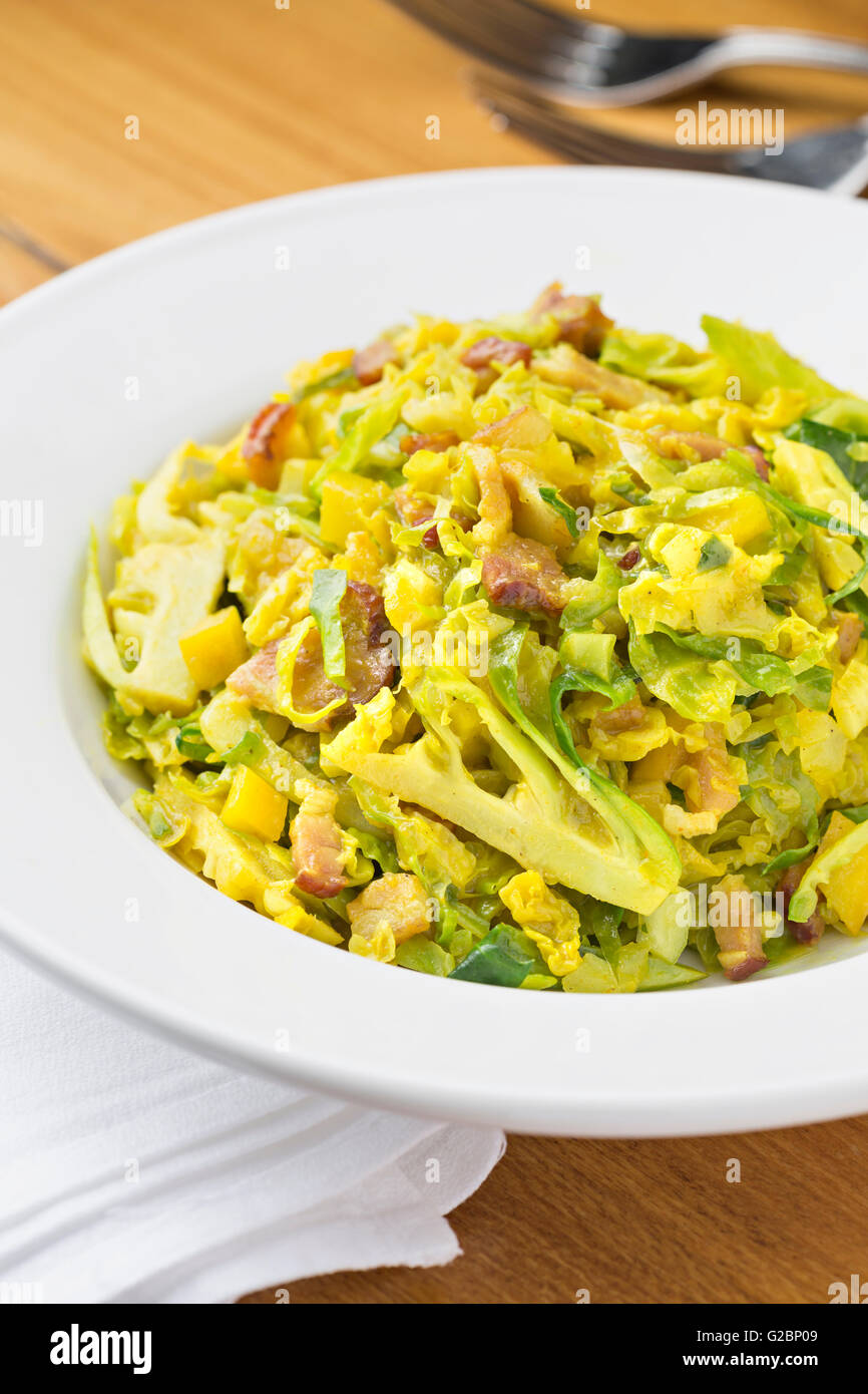 Curried brussels sprouts with bacon and honey. Stock Photo