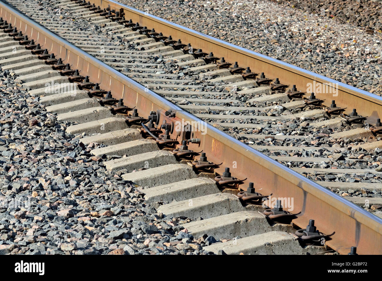 Arrow Rails. Rail and concrete sleepers closeup Stock Photo - Alamy