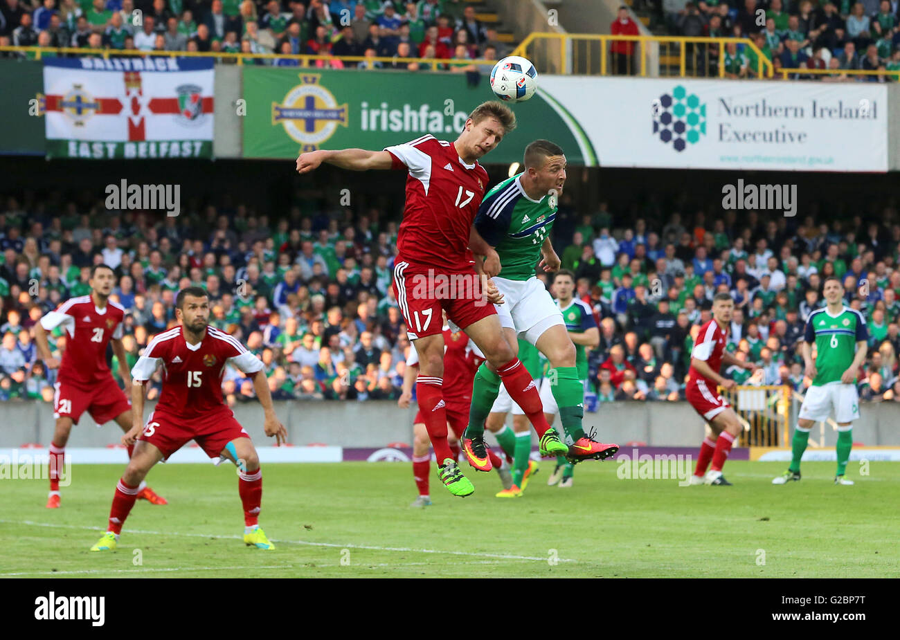 Northern Ireland's Conor Washington (right) and Belarus' Maksim Volodko in action during the International Friendly at Windsor Park, Belfast. Stock Photo