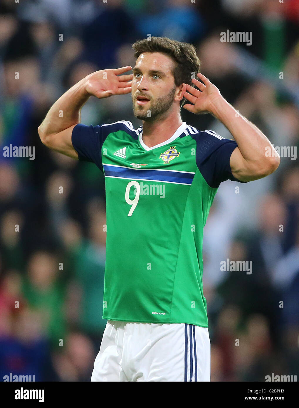 Northern Ireland's Will Grigg celebrates scoring his side's third goal during the International Friendly at Windsor Park, Belfast. Stock Photo