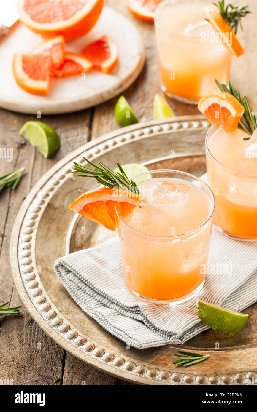 Refreshing Grapefruit and Tequila Palomas with Rosemary Stock Photo