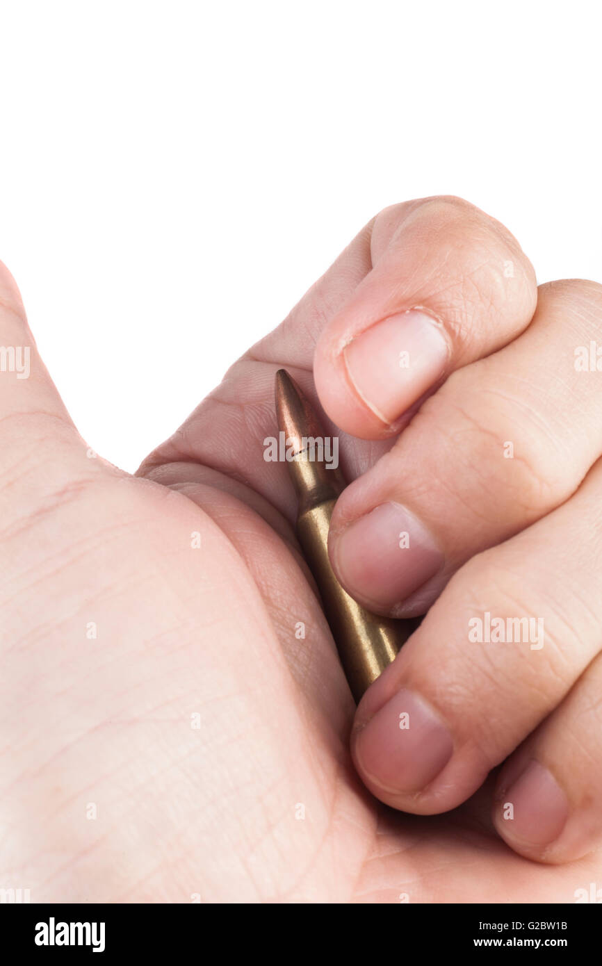 Hand Holding Single Rifle Bullet Isolated On White Background Stock Photo