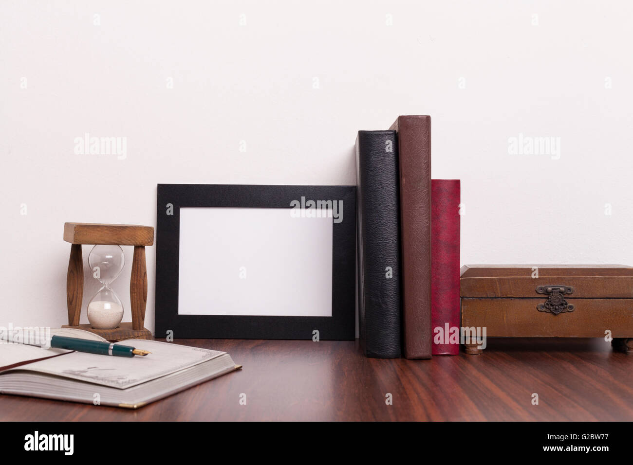 aged; ancient; book; knowledge; literature; old; retro; table; vintage; wall; antique; glass; hourglass; old; retro; sand; time; Stock Photo