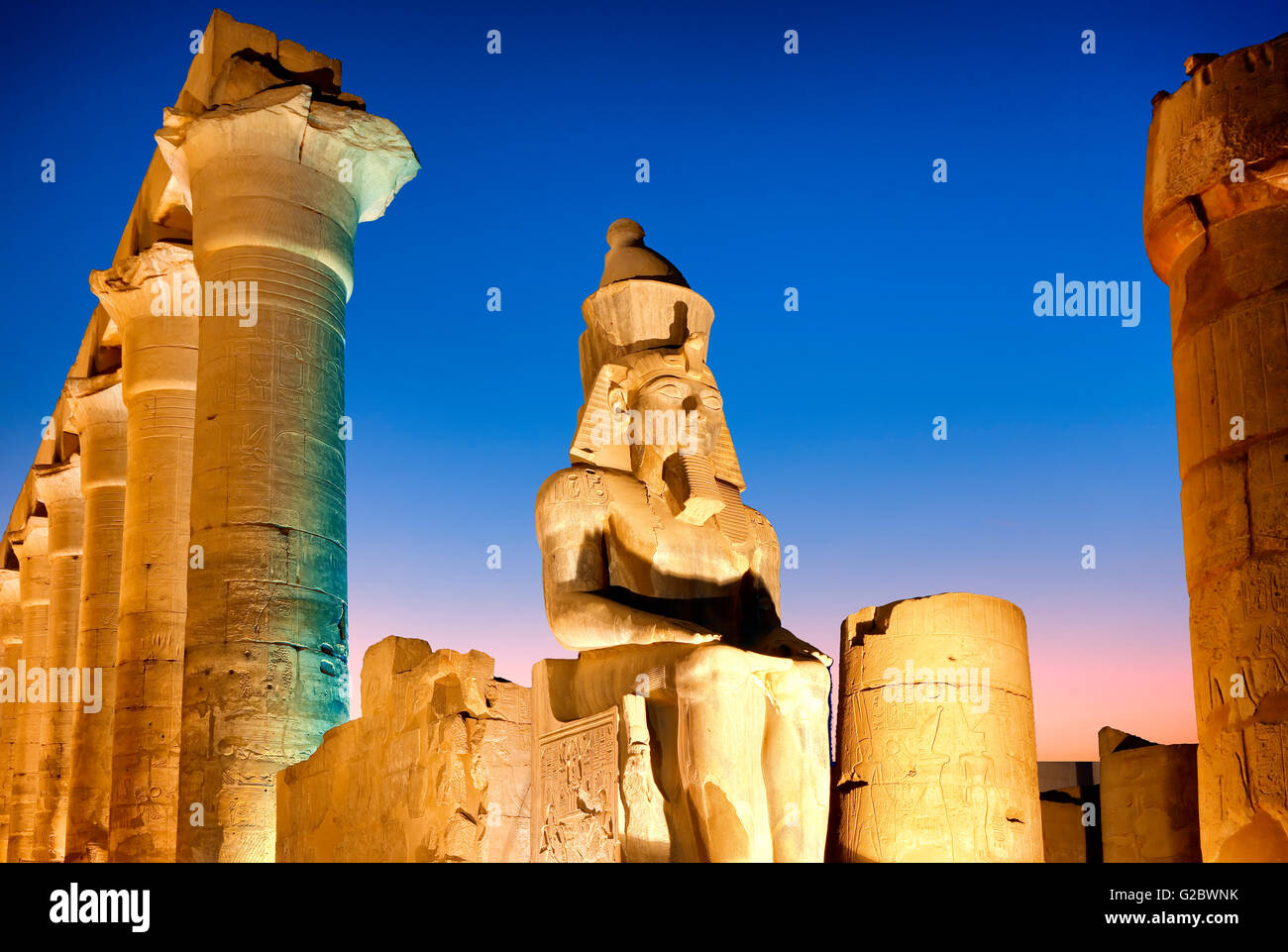 Statue of the pharaoh Ramesses II in Luxor temple at night Stock Photo ...