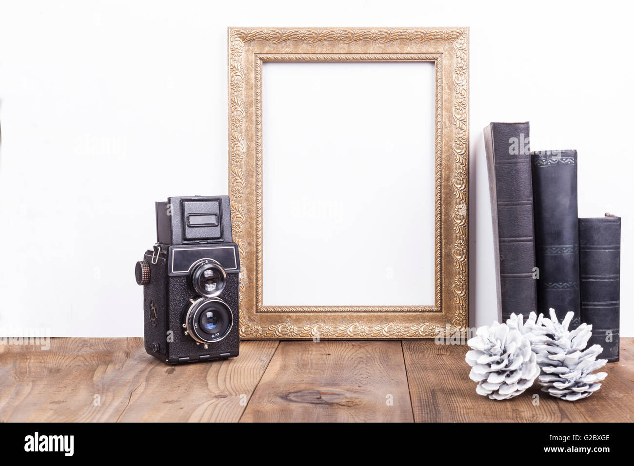 Vertical Golden Empty Frame With Old Books And Old Cameraon Brown Wood ...