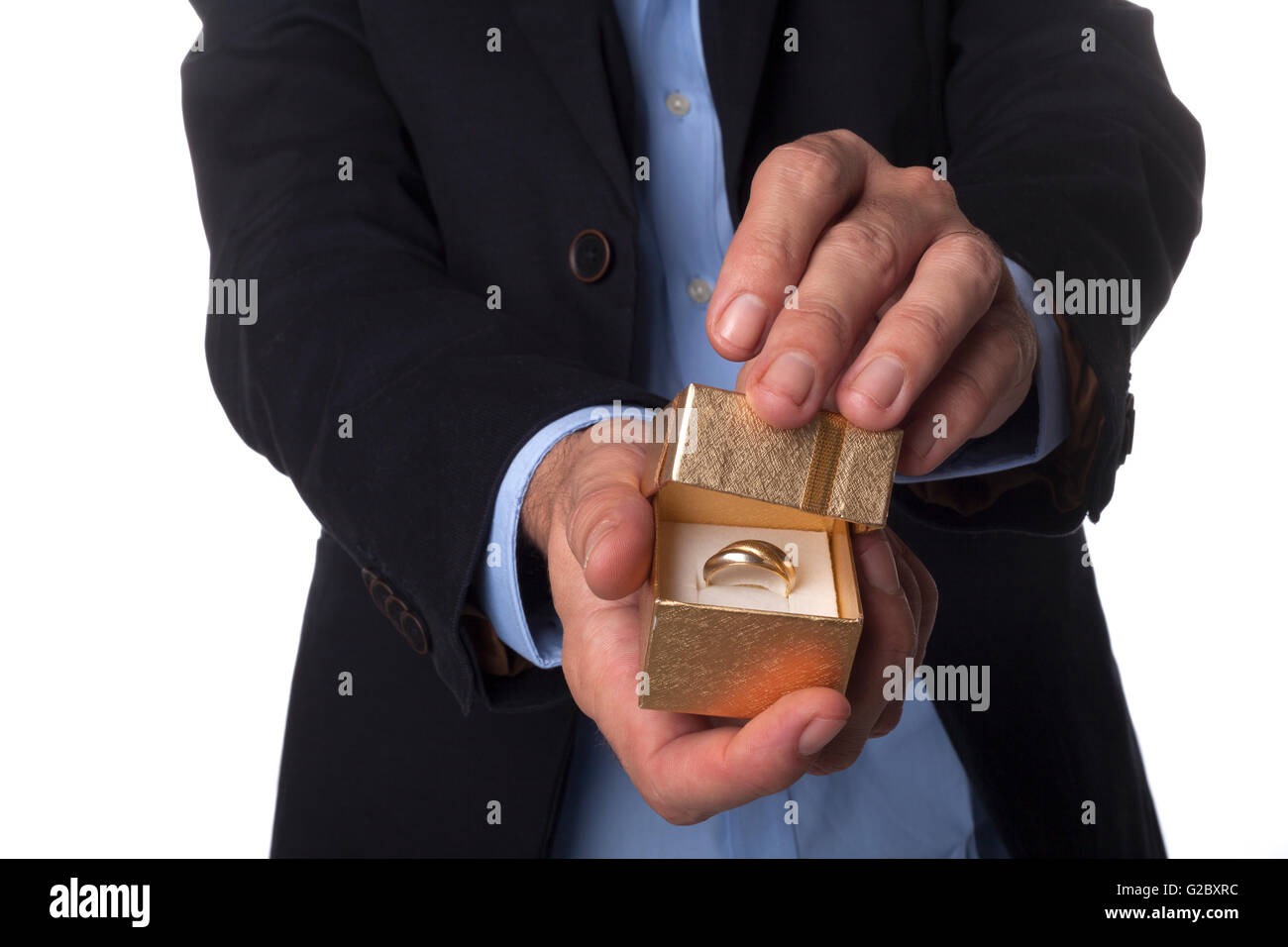 Man Hand in Suit Holding Golden Jewelry Box Isolated on White Background Stock Photo